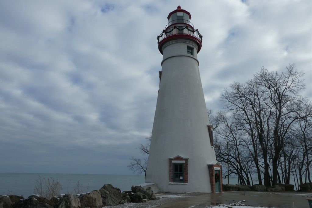 The Marblehead Lighthouse against a snowy sky. 