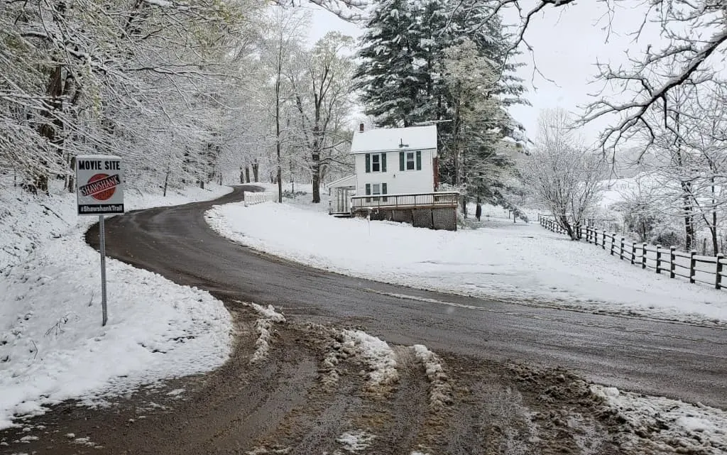 Winter road with Shawshank Trail sign.